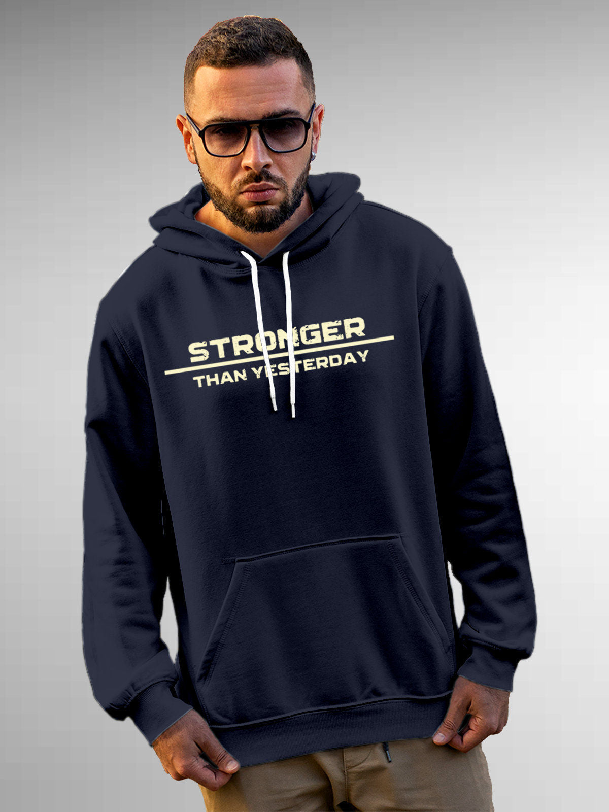 Model wearing Men's Navy Blue Hoodie Sweatshirt with 'Stronger Than Yesterday' design, offering effortless style and premium comfort