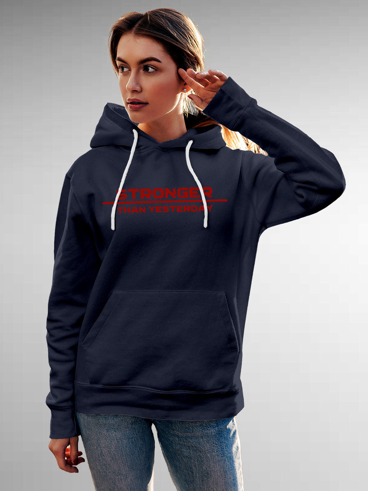 Model wearing Women's Navy Blue Hoodie Sweatshirt with 'Stronger Than Yesterday' design, offering effortless style and premium comfort