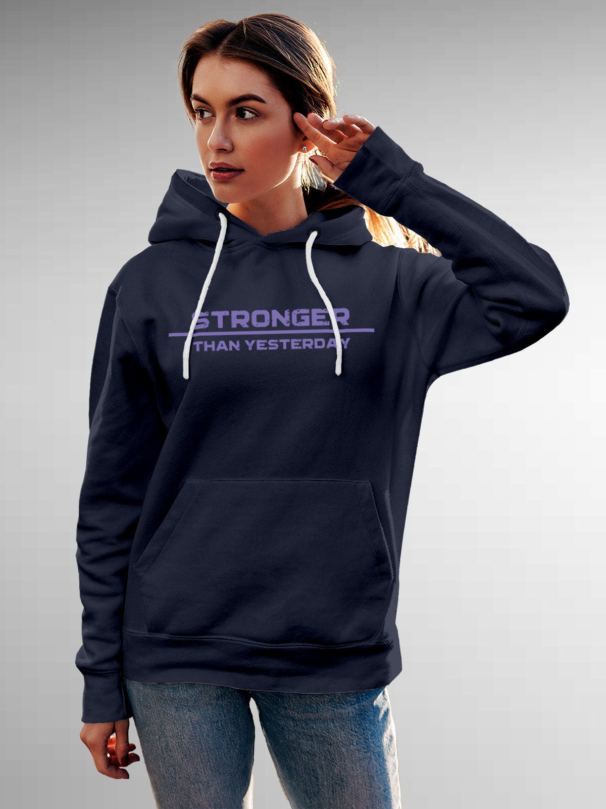 Model wearing Women's Navy Blue Hoodie Sweatshirt with 'Stronger Than Yesterday' design, offering effortless style and premium comfort