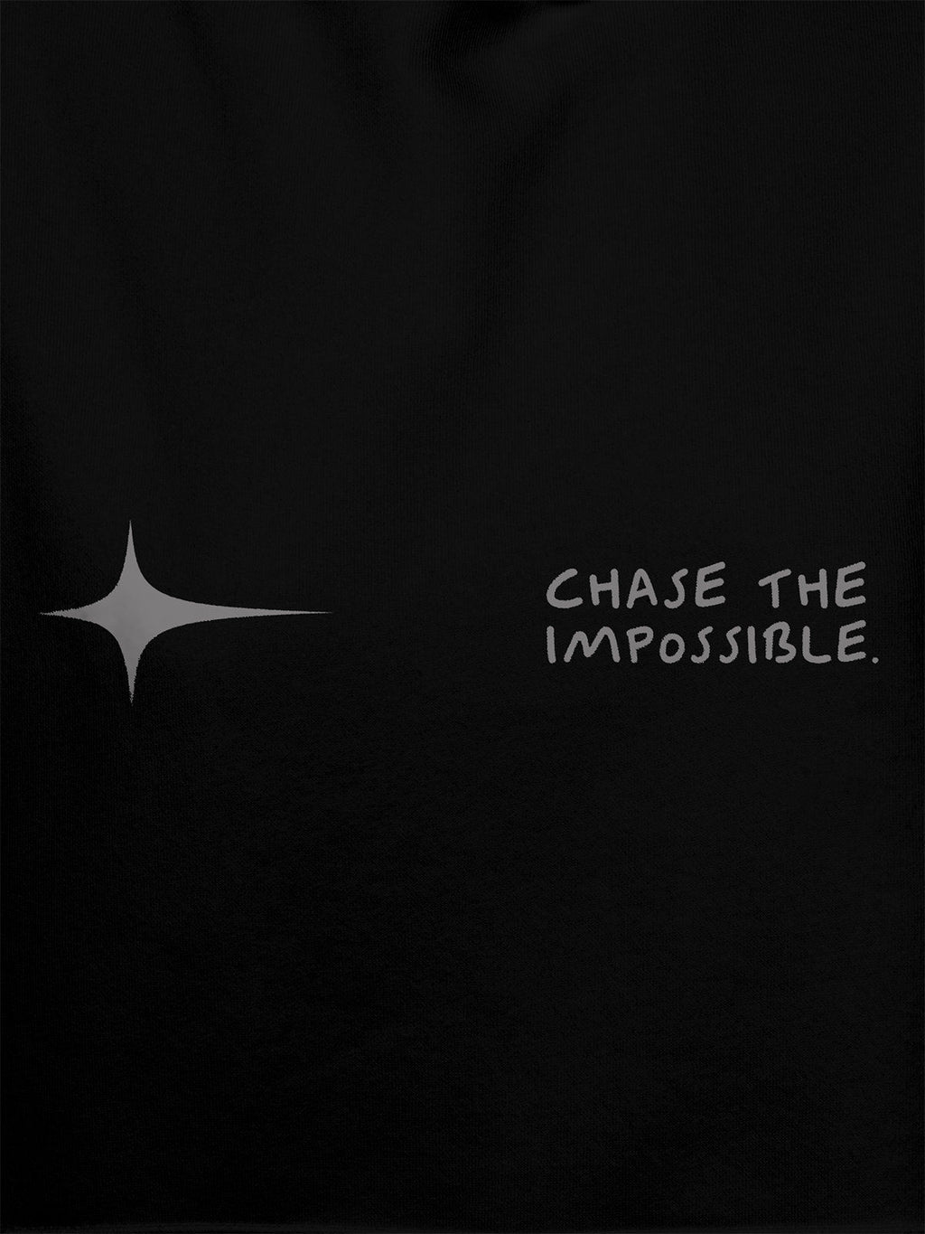 Close up of 'Chase The Impossible' design on Men's Black Hoodie Sweatshirt, highlighting intricate details and vibrant print.