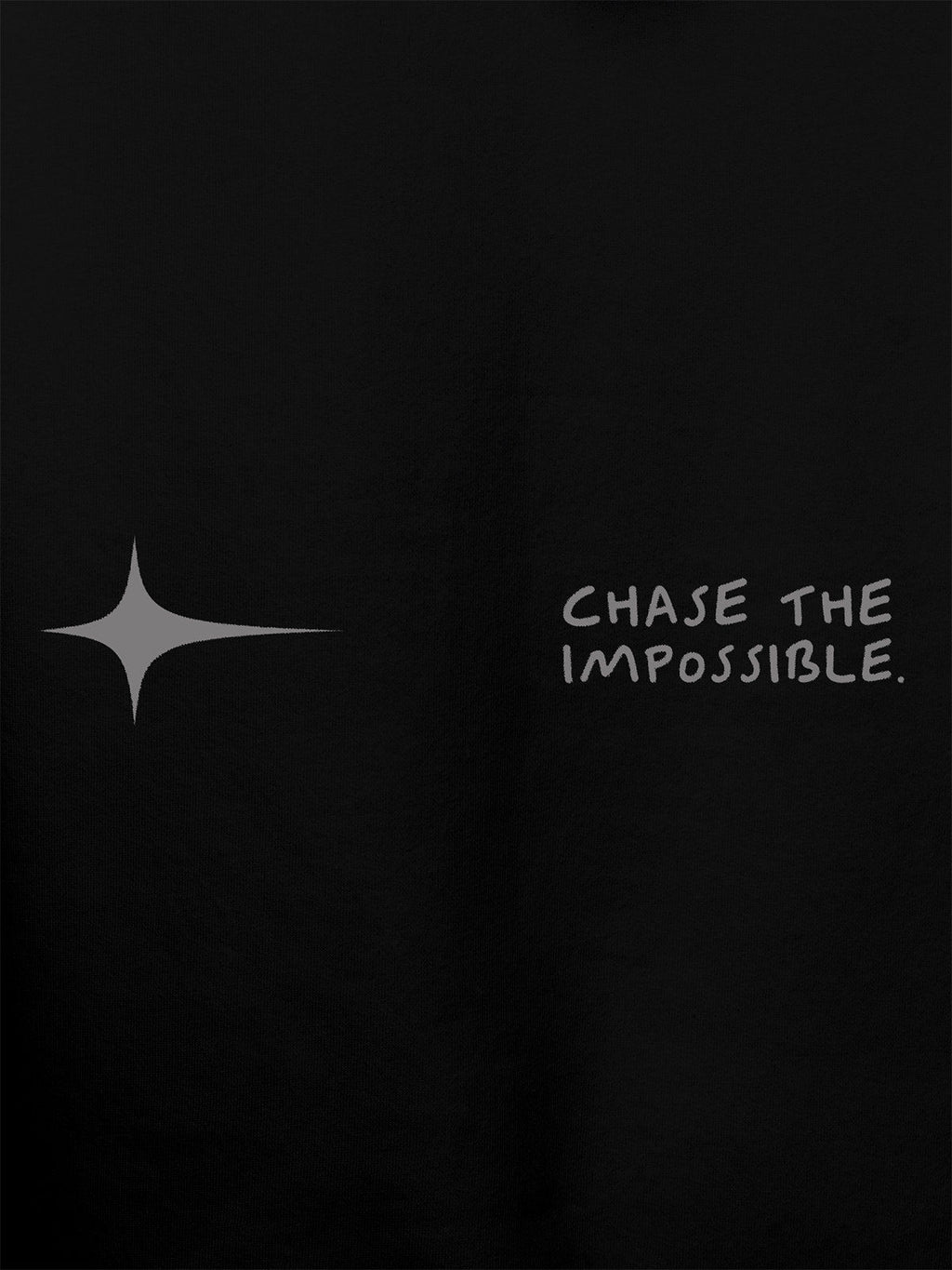 Close up of 'Chase The Impossible' design on Women's Black Hoodie Sweatshirt, highlighting intricate details and vibrant print.