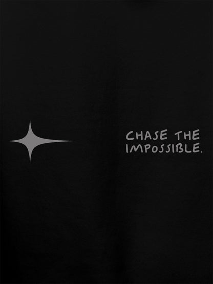 Close up of 'Chase The Impossible' design on Women's Black Hoodie Sweatshirt, highlighting intricate details and vibrant print.