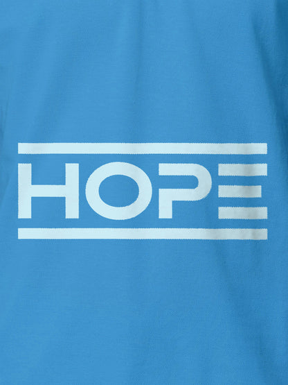 Close up of 'Hope' design on Men's Blue Polo T-shirt, highlighting intricate details and vibrant print.