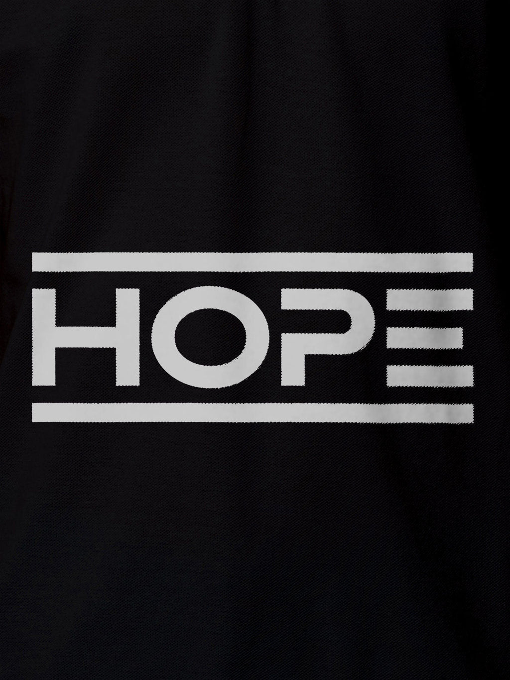 Close up of 'Hope' design on Men's Black Polo T-shirt, highlighting intricate details and vibrant print.