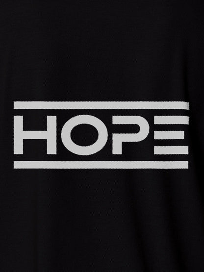 Close up of 'Hope' design on Women's Black Polo T-shirt, highlighting intricate details and vibrant print.