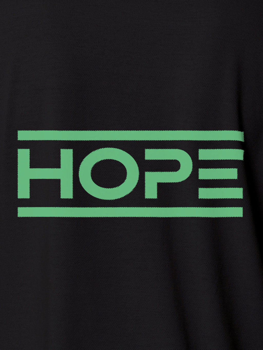 Close up of 'Hope' design on Women's Dark Grey Polo T-shirt, highlighting intricate details and vibrant print.