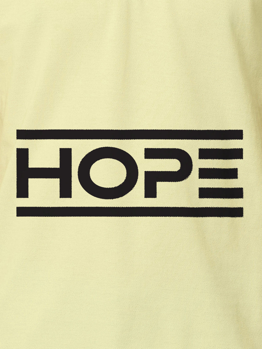 Close up of 'Hope' design on Men's Yellow Polo T-shirt, highlighting intricate details and vibrant print.