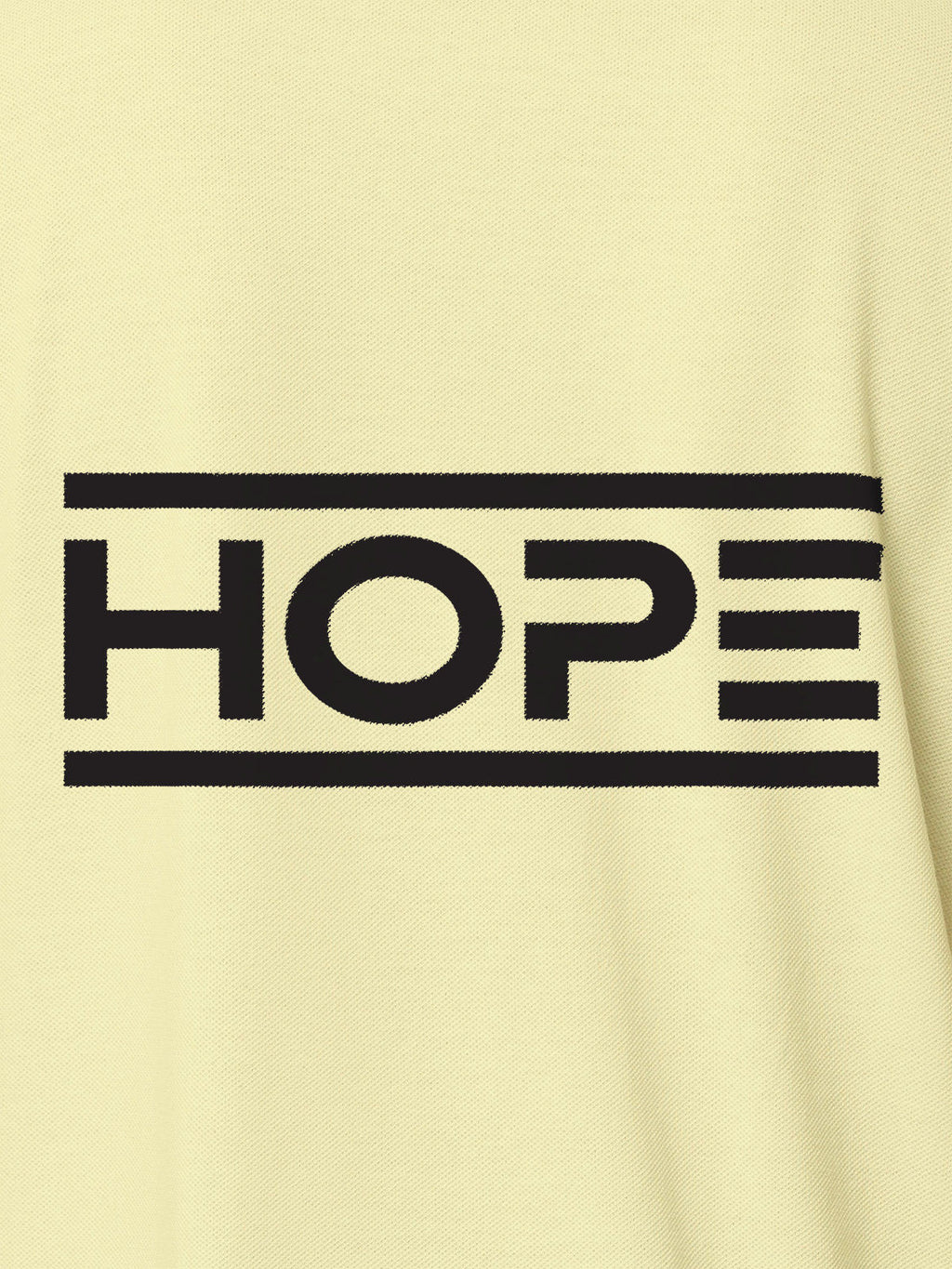 Close up of 'Hope' design on Women's Yellow Polo T-shirt, highlighting intricate details and vibrant print.