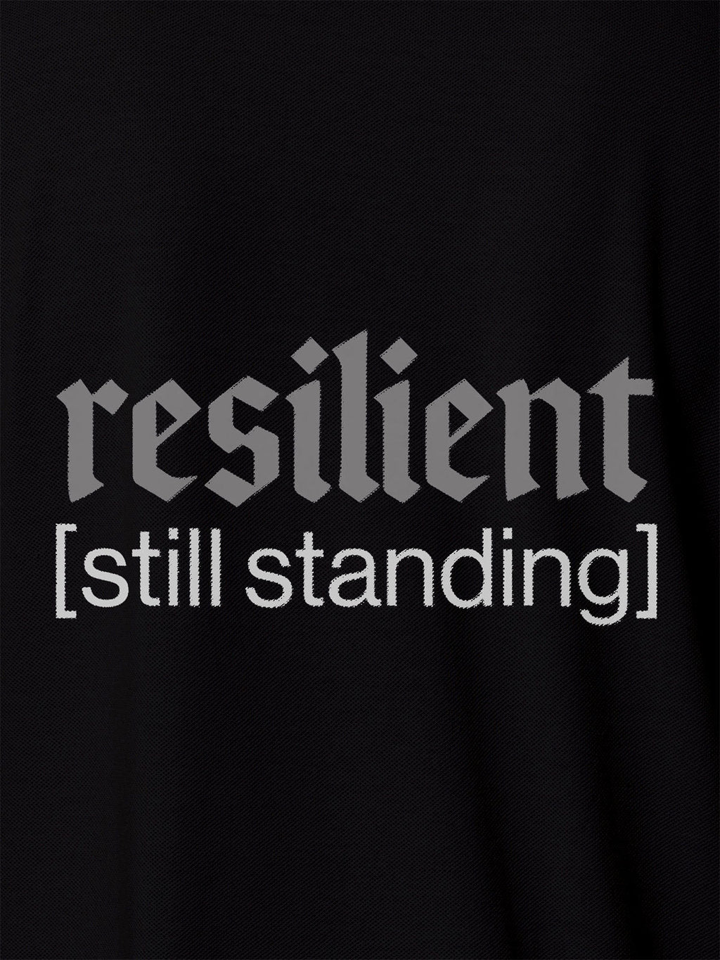 Close up of 'Resilient' design on Men's Black Polo T-shirt, highlighting intricate details and vibrant print.