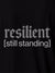 Close up of 'Resilient' design on Men's Black Polo T-shirt, highlighting intricate details and vibrant print.