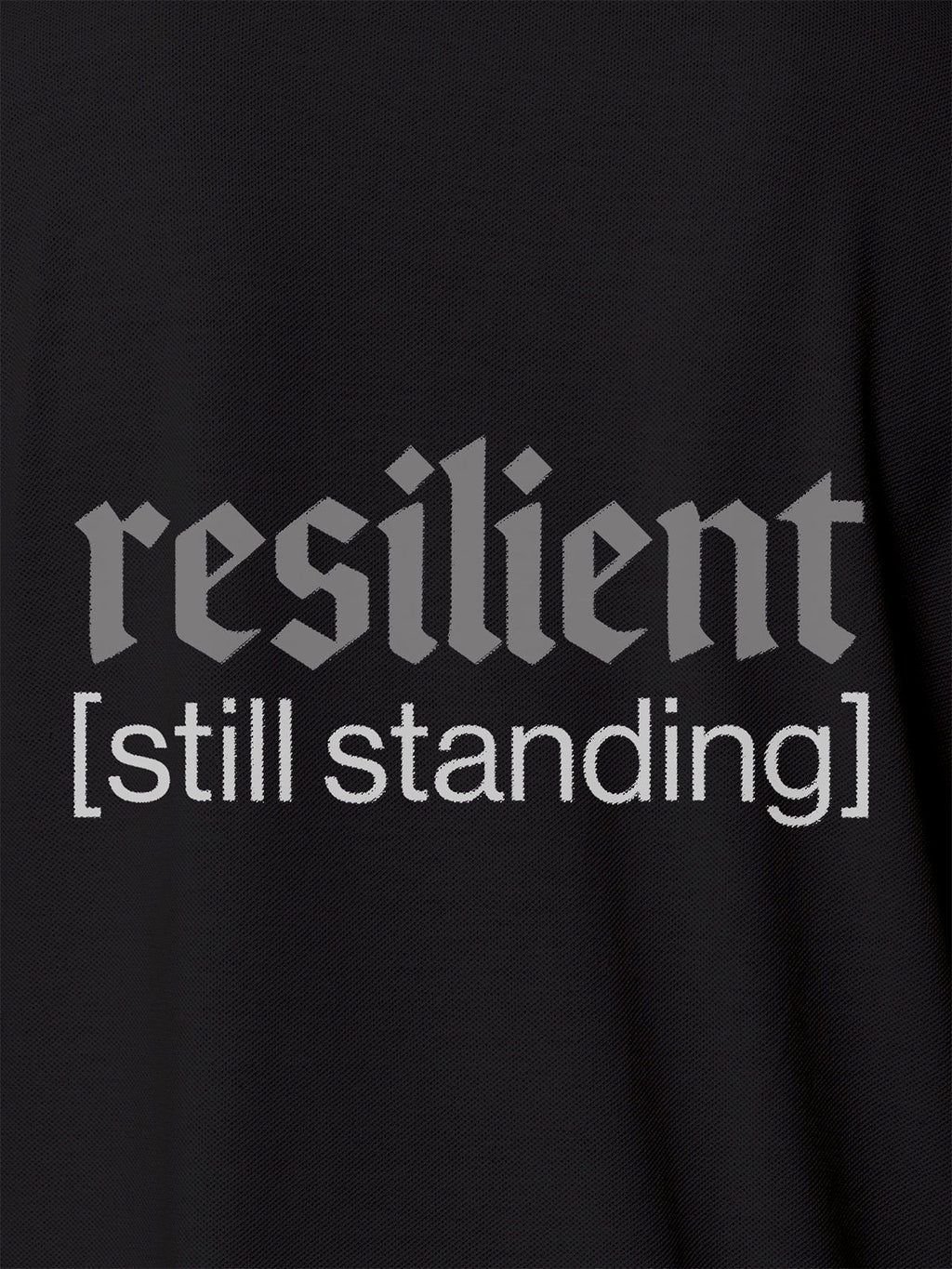 Close up of 'Resilient' design on Men's Dark Grey Polo T-shirt, highlighting intricate details and vibrant print.