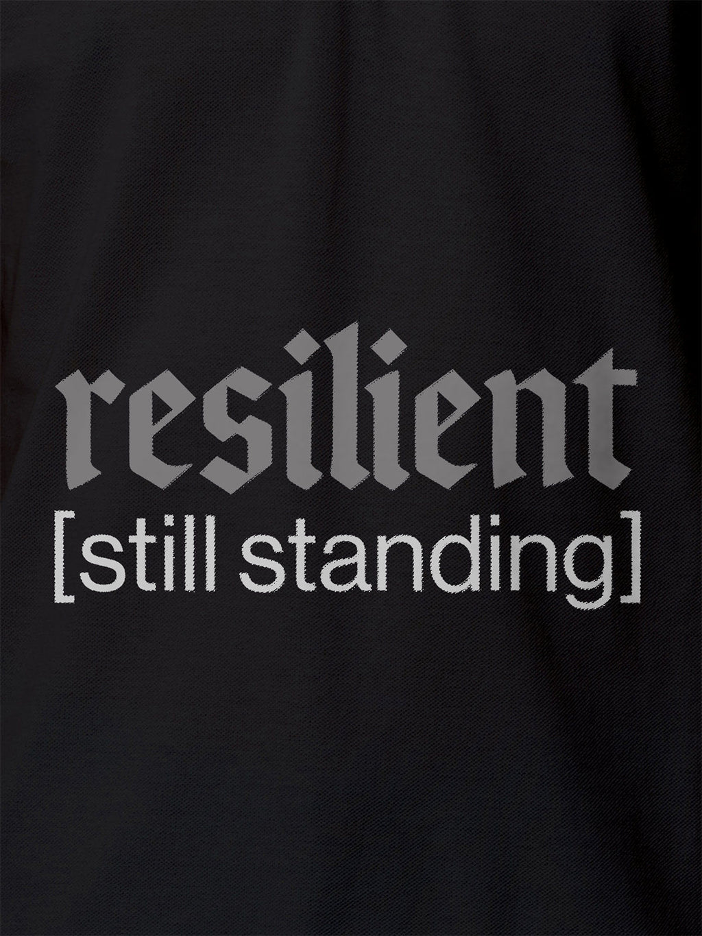 Close up of 'Resilient' design on Women's Dark Grey Polo T-shirt, highlighting intricate details and vibrant print.