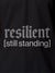 Close up of 'Resilient' design on Women's Dark Grey Polo T-shirt, highlighting intricate details and vibrant print.