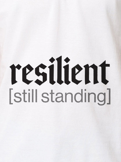 Close up of 'Resilient' design on Women's White Polo T-shirt, highlighting intricate details and vibrant print.