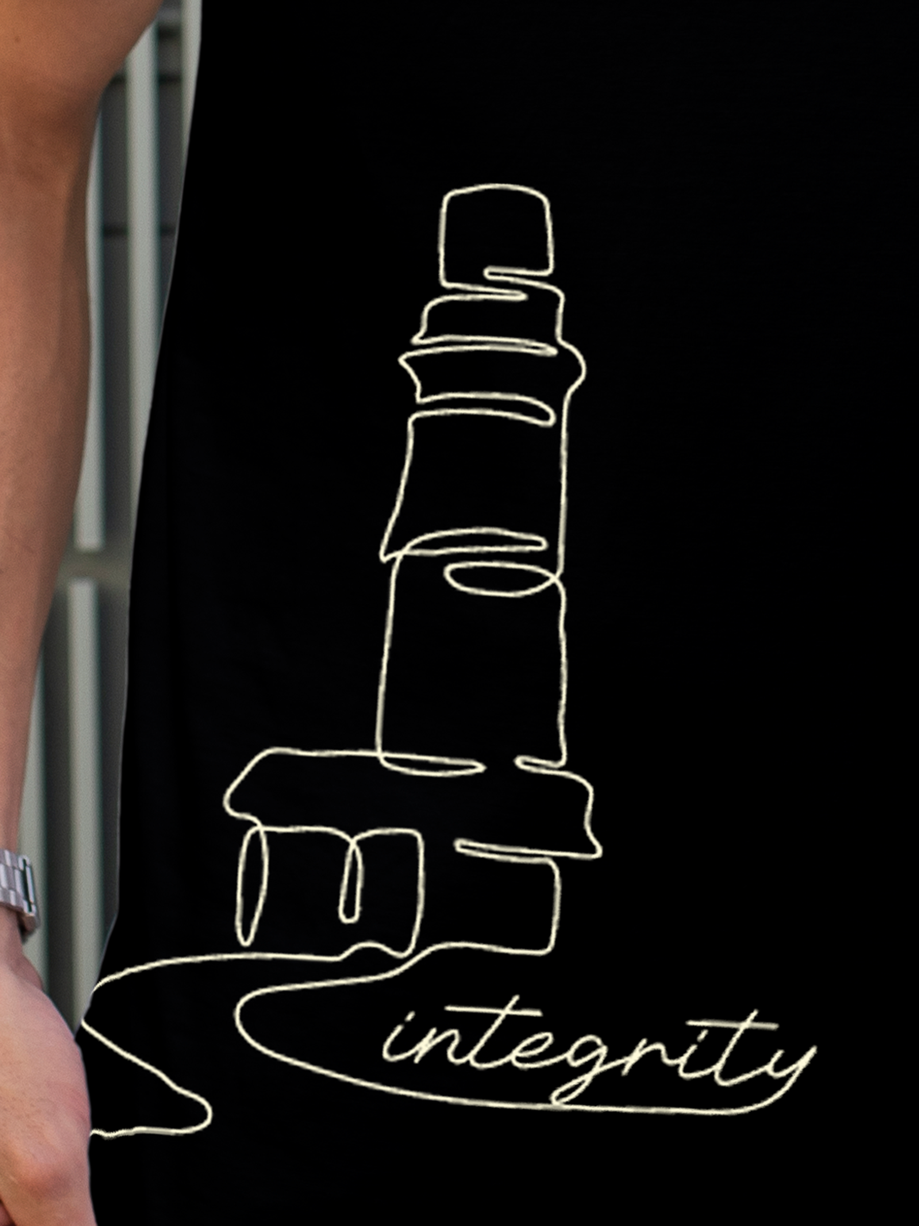 Close up of 'Integrity' design on Men's Black Polo T-shirt, highlighting intricate details and vibrant print.