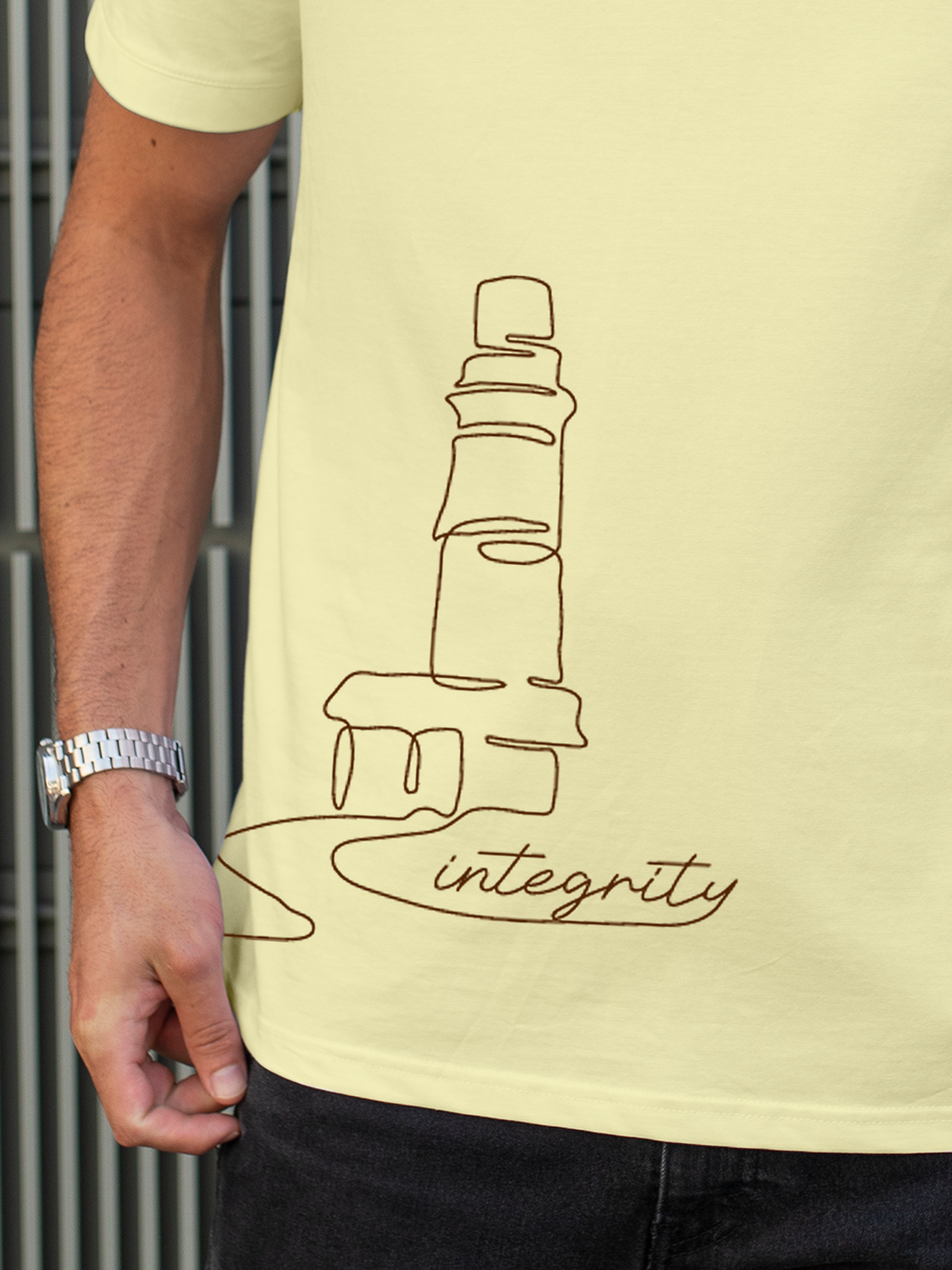 Close up of 'Integrity' design on Men's Yellow Polo T-shirt, highlighting intricate details and vibrant print.