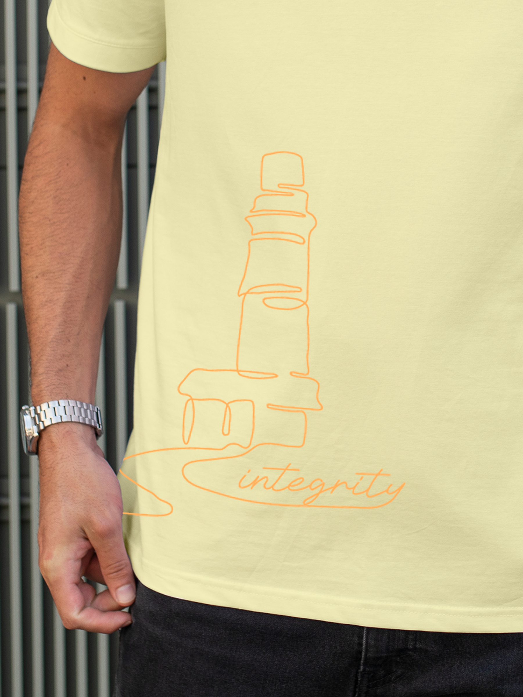 Close up of 'Integrity' design on Men's Yellow Polo T-shirt, highlighting intricate details and vibrant print.