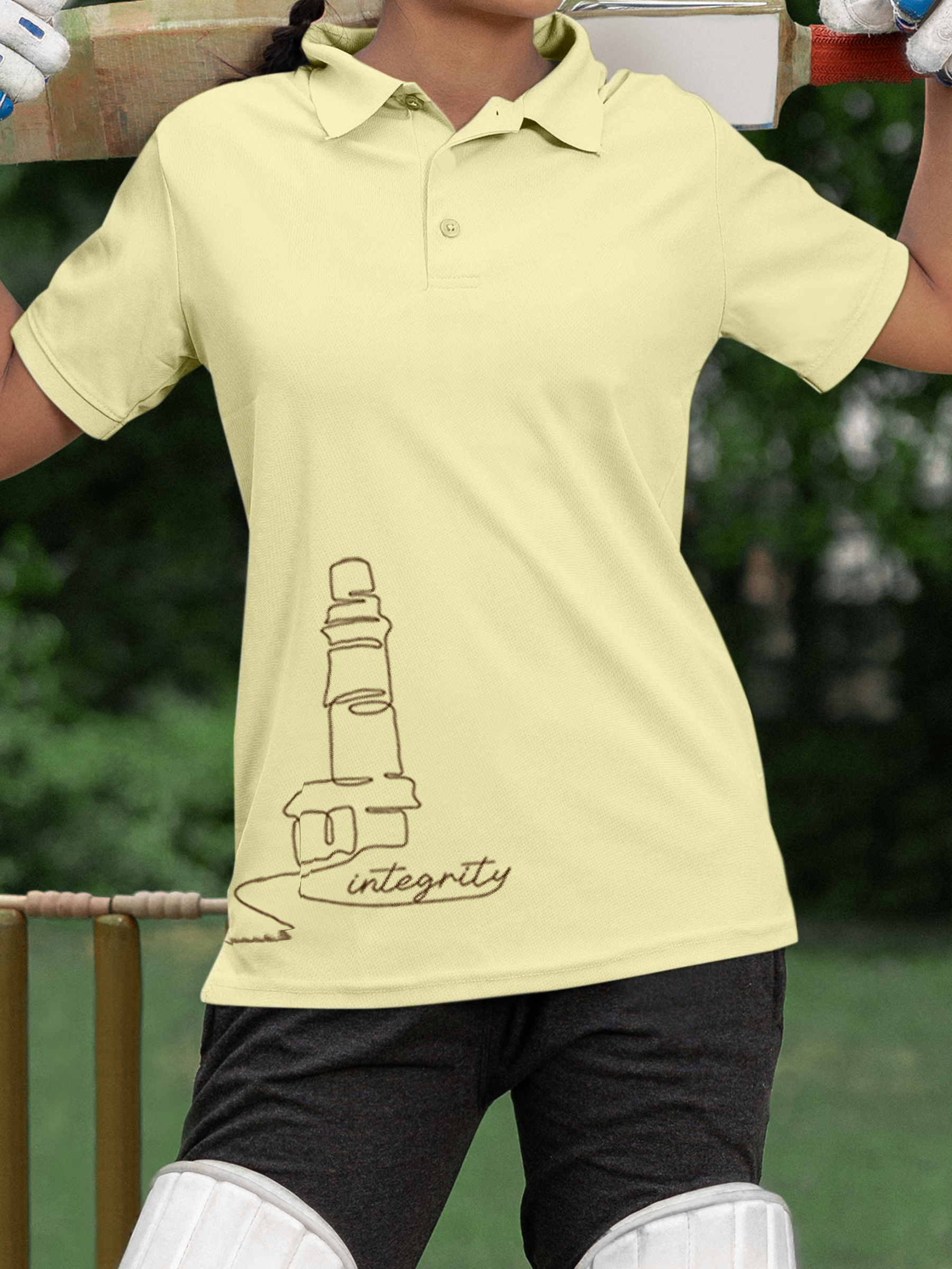 Close up of 'Integrity' design on Women's Yellow Polo T-shirt, highlighting intricate details and vibrant print.
