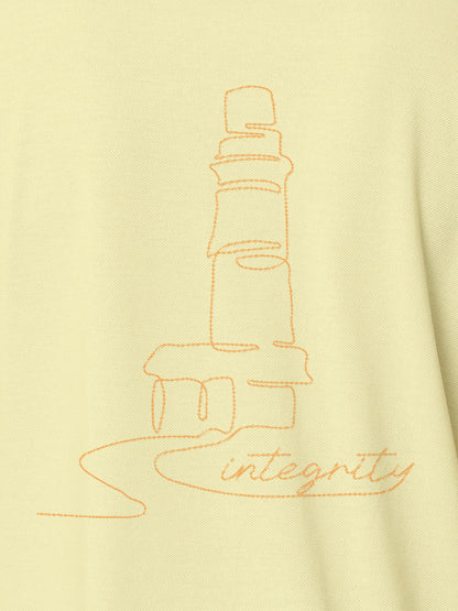 Close up of 'Integrity' design on Women's Yellow Polo T-shirt, highlighting intricate details and vibrant print.
