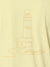 Close up of 'Integrity' design on Women's Yellow Polo T-shirt, highlighting intricate details and vibrant print.