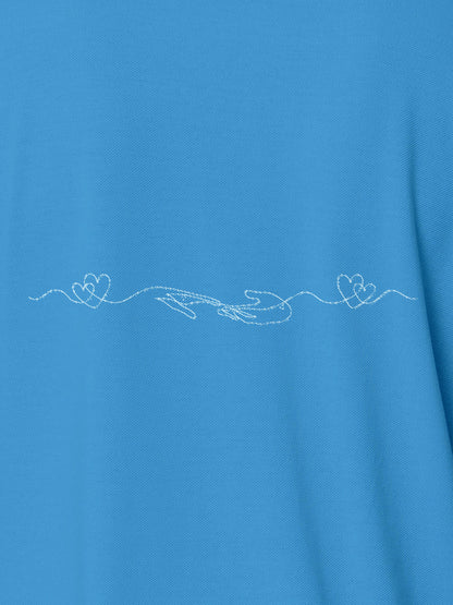 Close up of 'Empathy' design on Men's Blue Polo T-shirt, highlighting intricate details and vibrant print.
