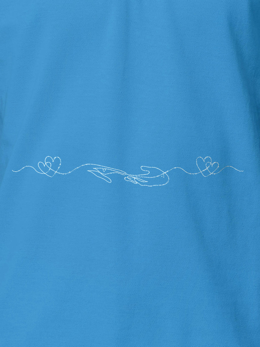 Close up of 'Empathy' design on Women's Blue Polo T-shirt, highlighting intricate details and vibrant print.