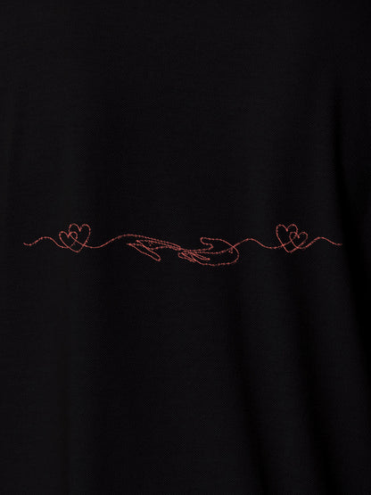 Close up of 'Empathy' design on Men's Black Polo T-shirt, highlighting intricate details and vibrant print.