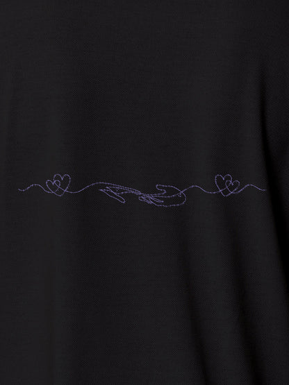 Close up of 'Empathy' design on Men's Dark Grey Polo T-shirt, highlighting intricate details and vibrant print.