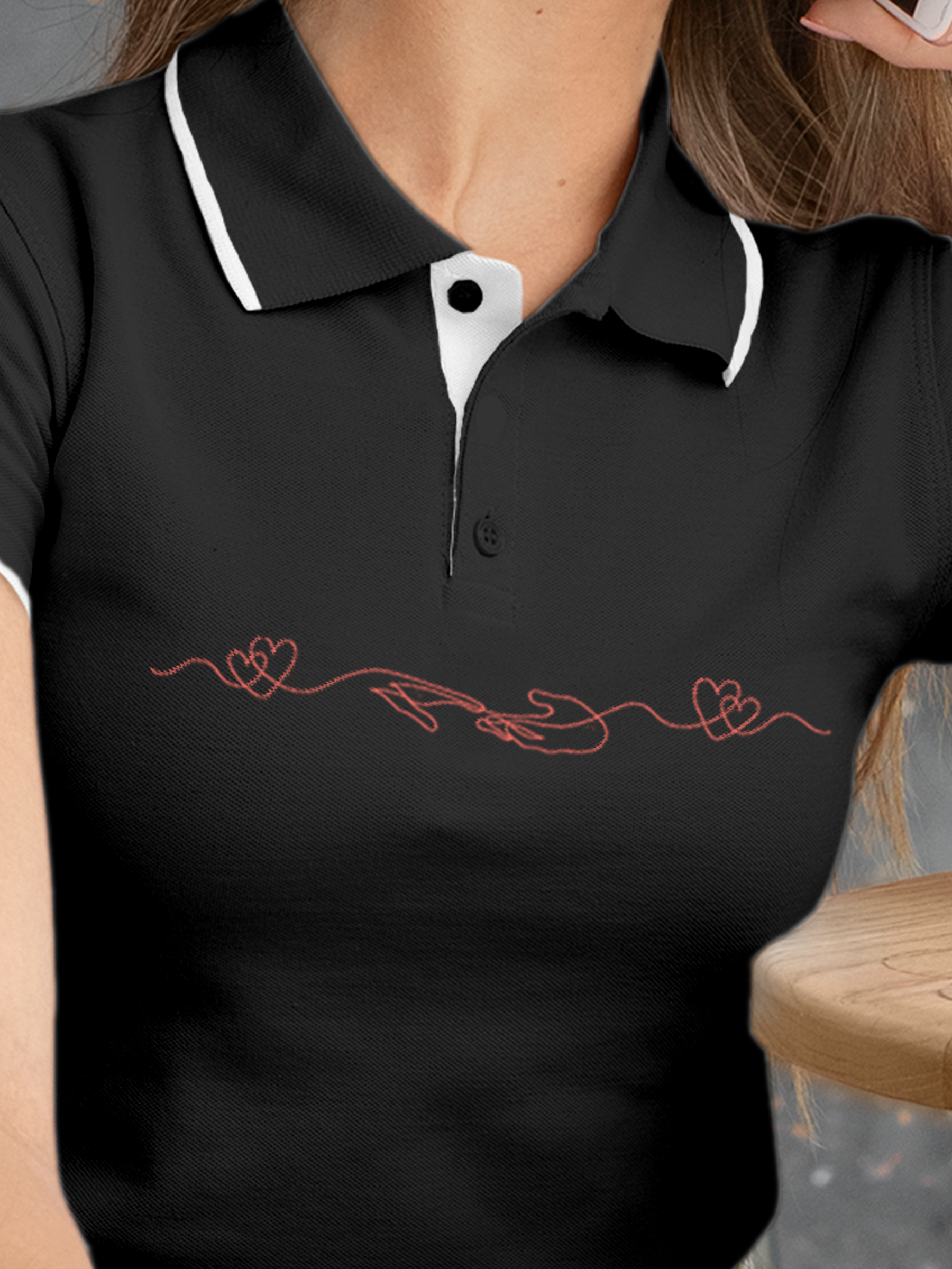 Close up of 'Empathy' design on Women's Charcoal Grey Polo T-shirt, highlighting intricate details and vibrant print.