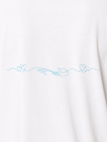 Close up of 'Empathy' design on Men's White Polo T-shirt, highlighting intricate details and vibrant print.