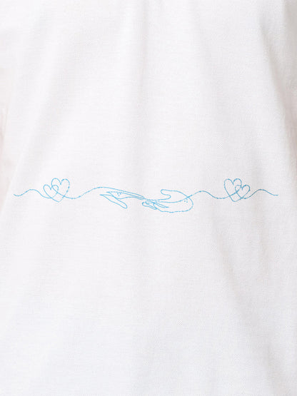 Close up of 'Empathy' design on Women's White Polo T-shirt, highlighting intricate details and vibrant print.