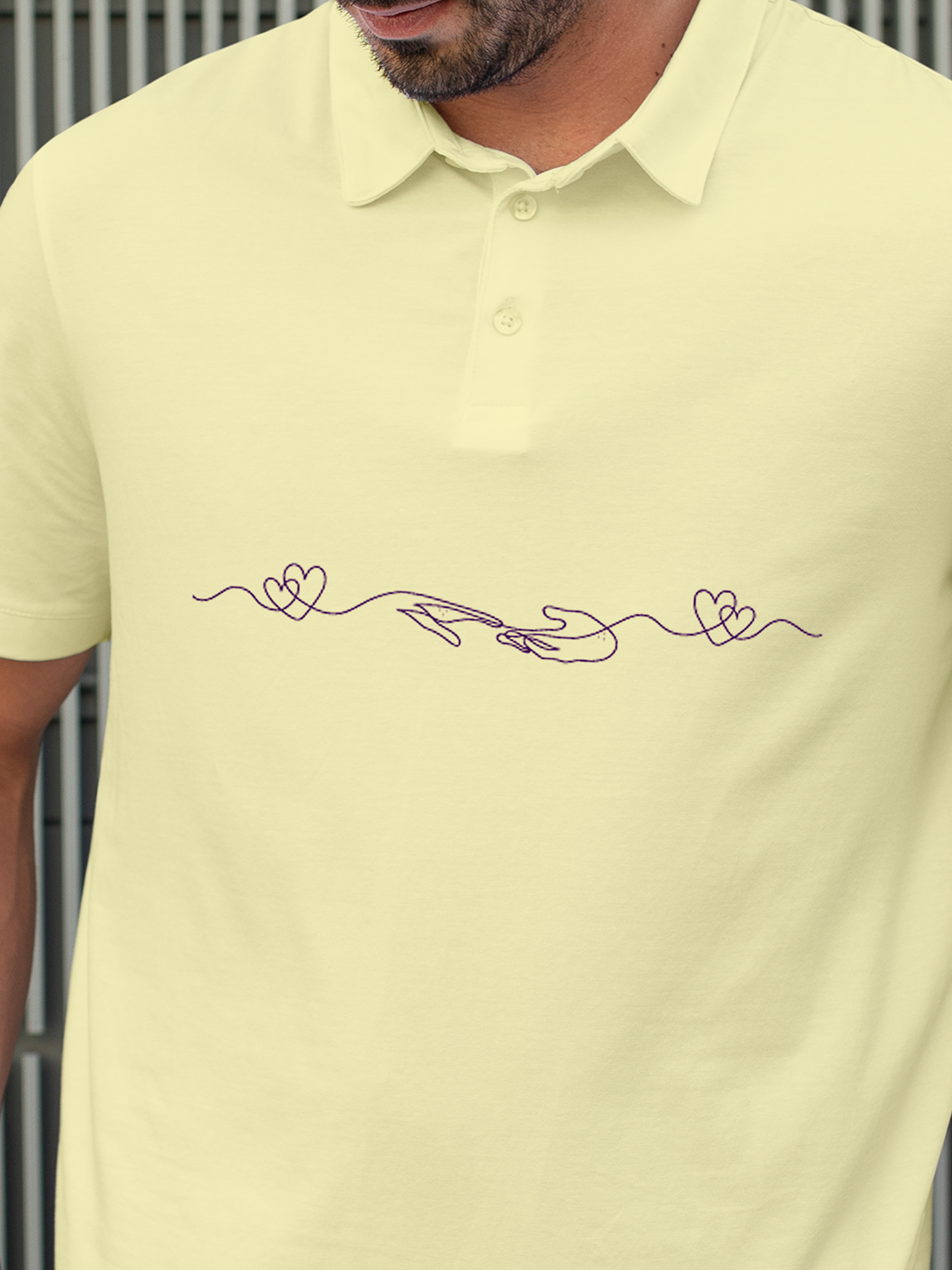 Close up of 'Empathy' design on Men's Yellow Polo T-shirt, highlighting intricate details and vibrant print.