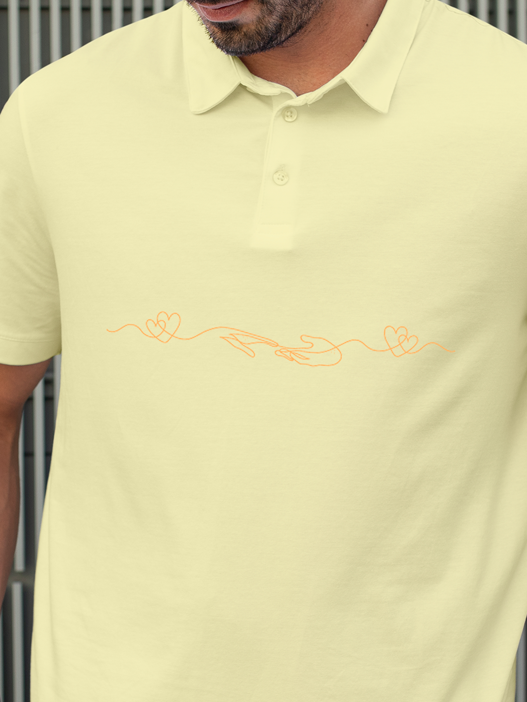 Close up of 'Empathy' design on Men's Yellow Polo T-shirt, highlighting intricate details and vibrant print.