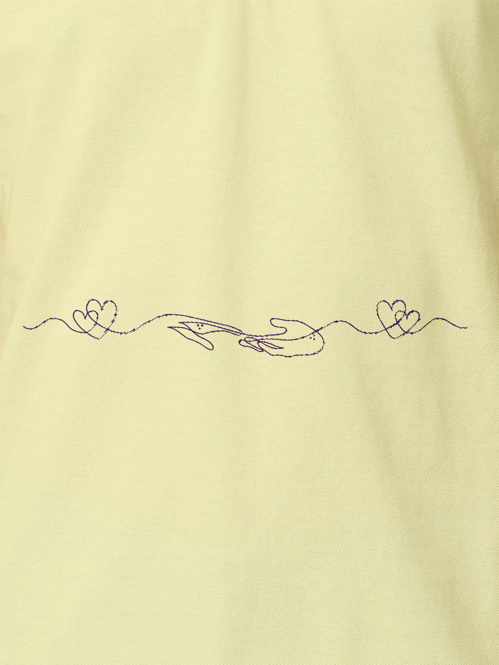 Close up of 'Empathy' design on Women's Yellow Polo T-shirt, highlighting intricate details and vibrant print.