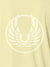 Close up of 'Free' design on Women's Yellow Polo T-shirt, highlighting intricate details and vibrant print.