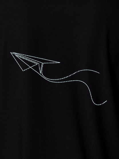 Close up of 'Empowered' design on Men's Black Polo T-shirt, highlighting intricate details and vibrant print.