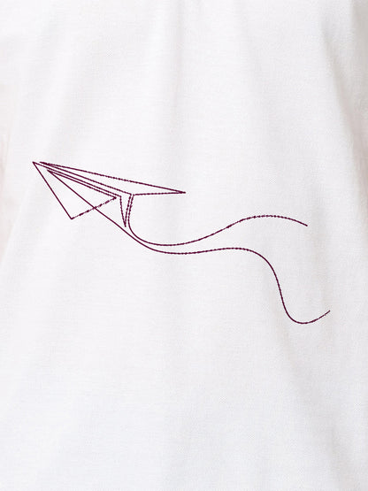 Close up of 'Empowered' design on Women's White Polo T-shirt, highlighting intricate details and vibrant print.