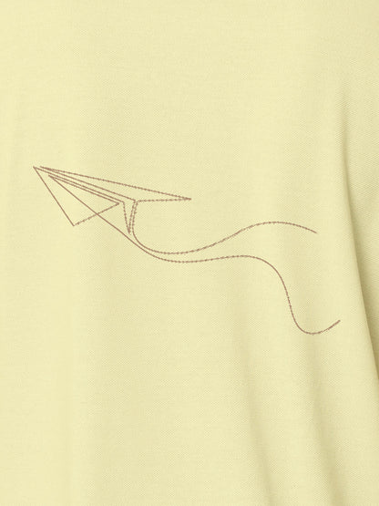 Close up of 'Empowered' design on Men's Yellow Polo T-shirt, highlighting intricate details and vibrant print.