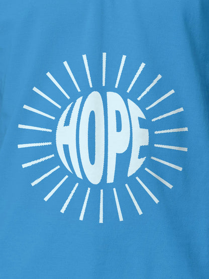 Close up of 'Hope' design on Men's Blue Polo T-shirt, highlighting intricate details and vibrant print.