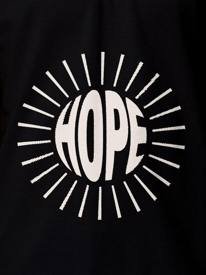 Close up of 'Hope' design on Men's Black Polo T-shirt, highlighting intricate details and vibrant print.