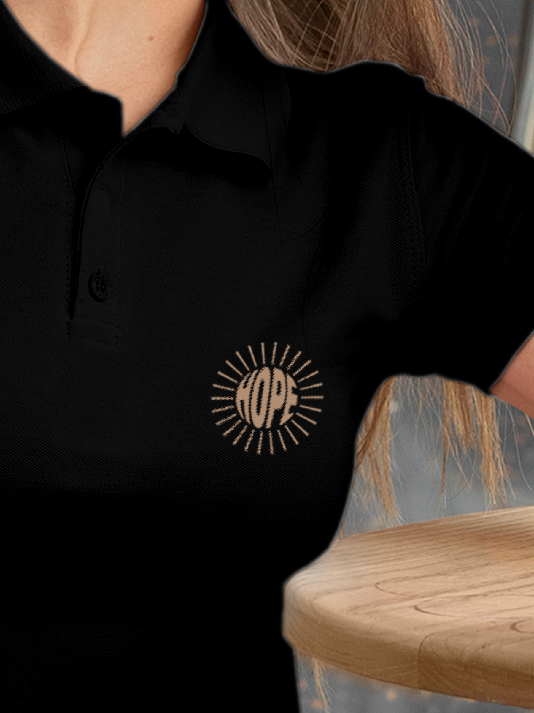 Close up of 'Hope' design on Women's Black Polo T-shirt, highlighting intricate details and vibrant print.