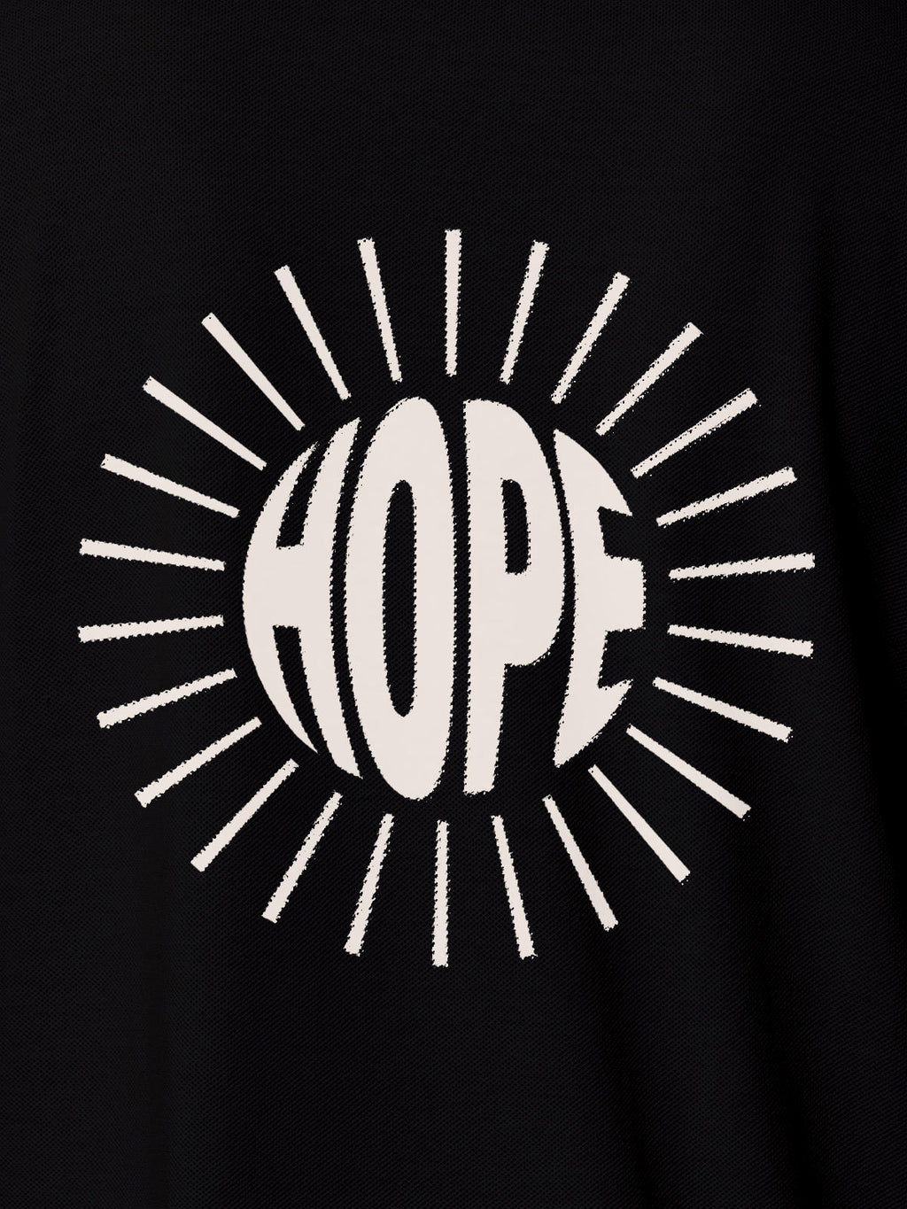 Close up of 'Hope' design on Women's Black Polo T-shirt, highlighting intricate details and vibrant print.