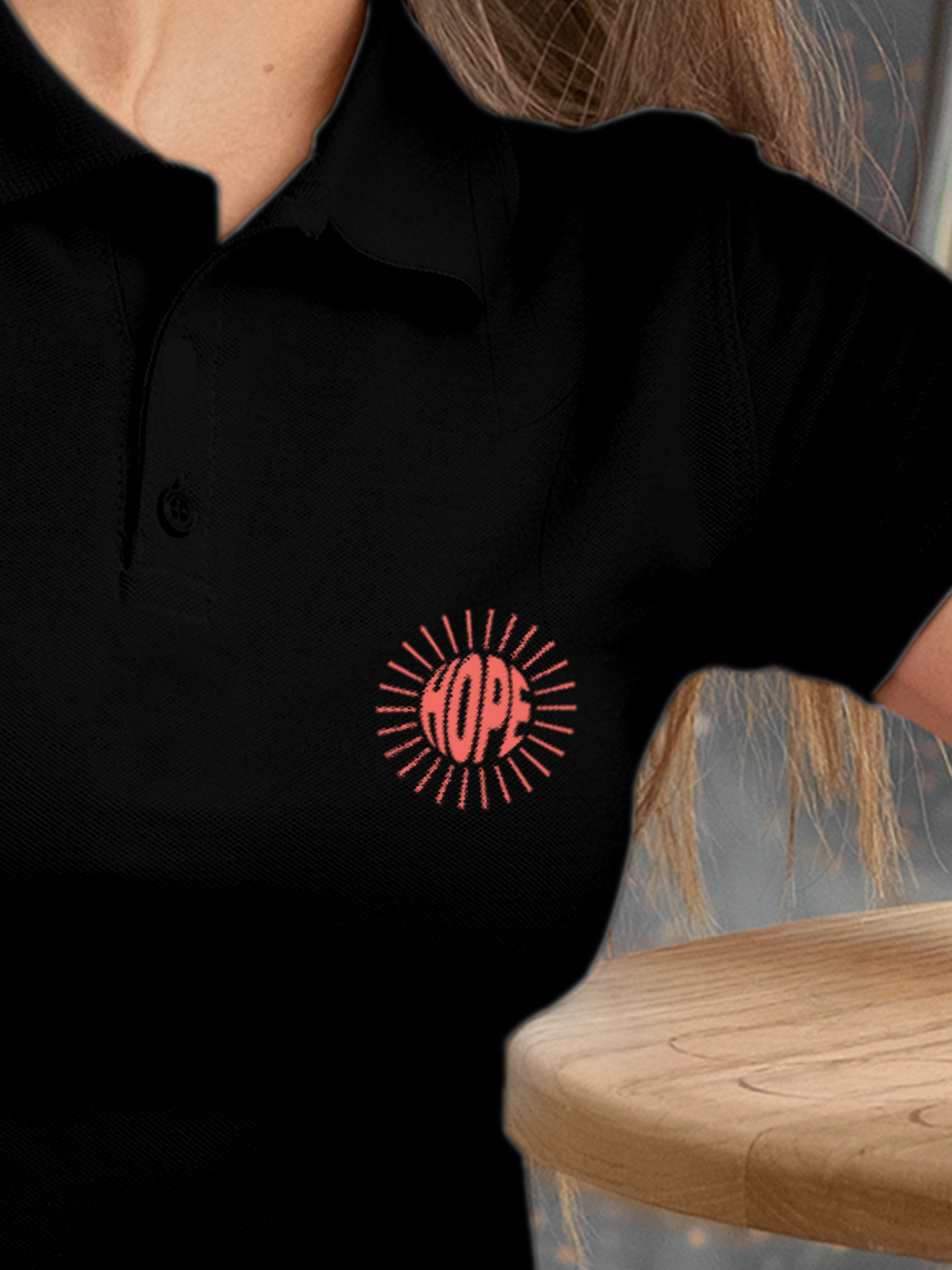 Close up of 'Hope' design on Women's Black Polo T-shirt, highlighting intricate details and vibrant print.