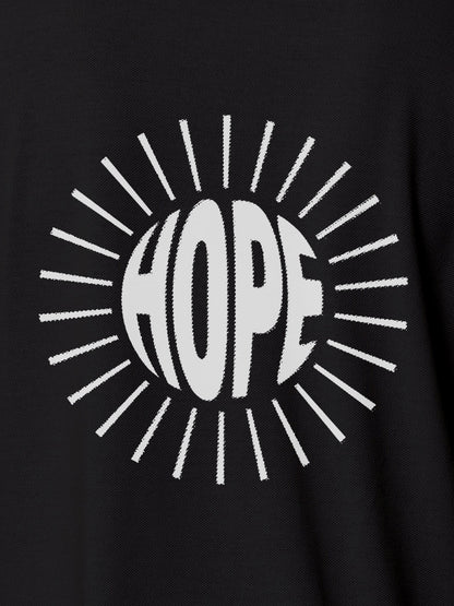 Close up of 'Hope' design on Women's Dark Grey Polo T-shirt, highlighting intricate details and vibrant print.