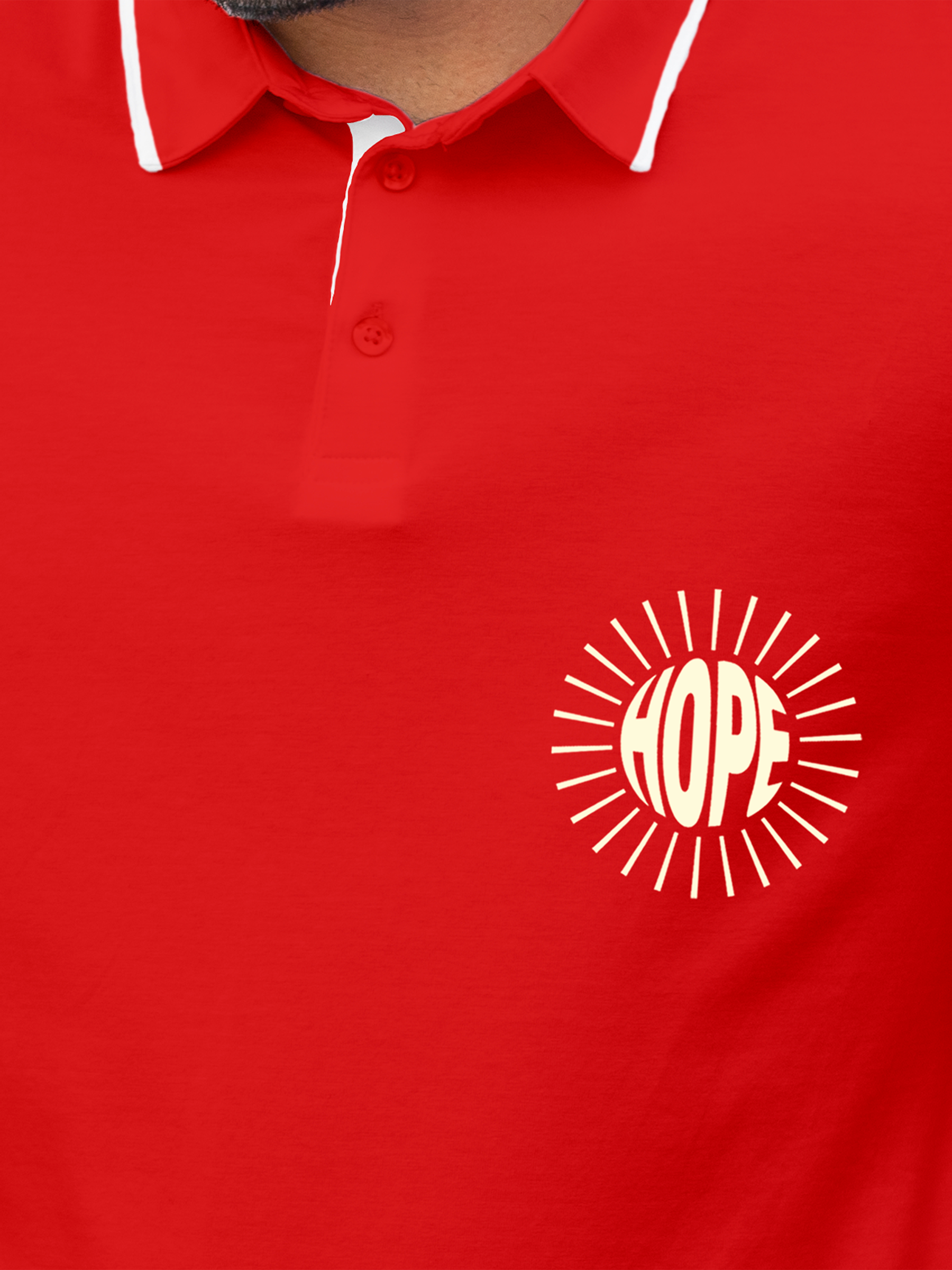 Close up of 'Hope' design on Men's Red Polo T-shirt, highlighting intricate details and vibrant print.