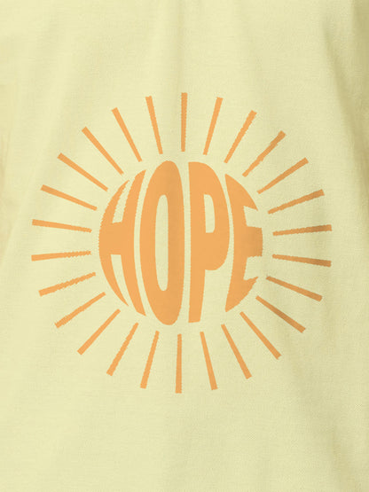 Close up of 'Hope' design on Men's Yellow Polo T-shirt, highlighting intricate details and vibrant print.