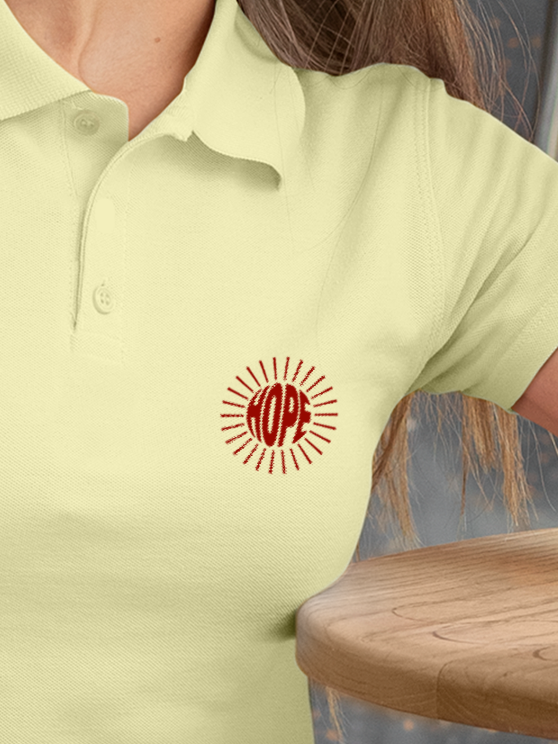 Close up of 'Hope' design on Women's Yellow Polo T-shirt, highlighting intricate details and vibrant print.