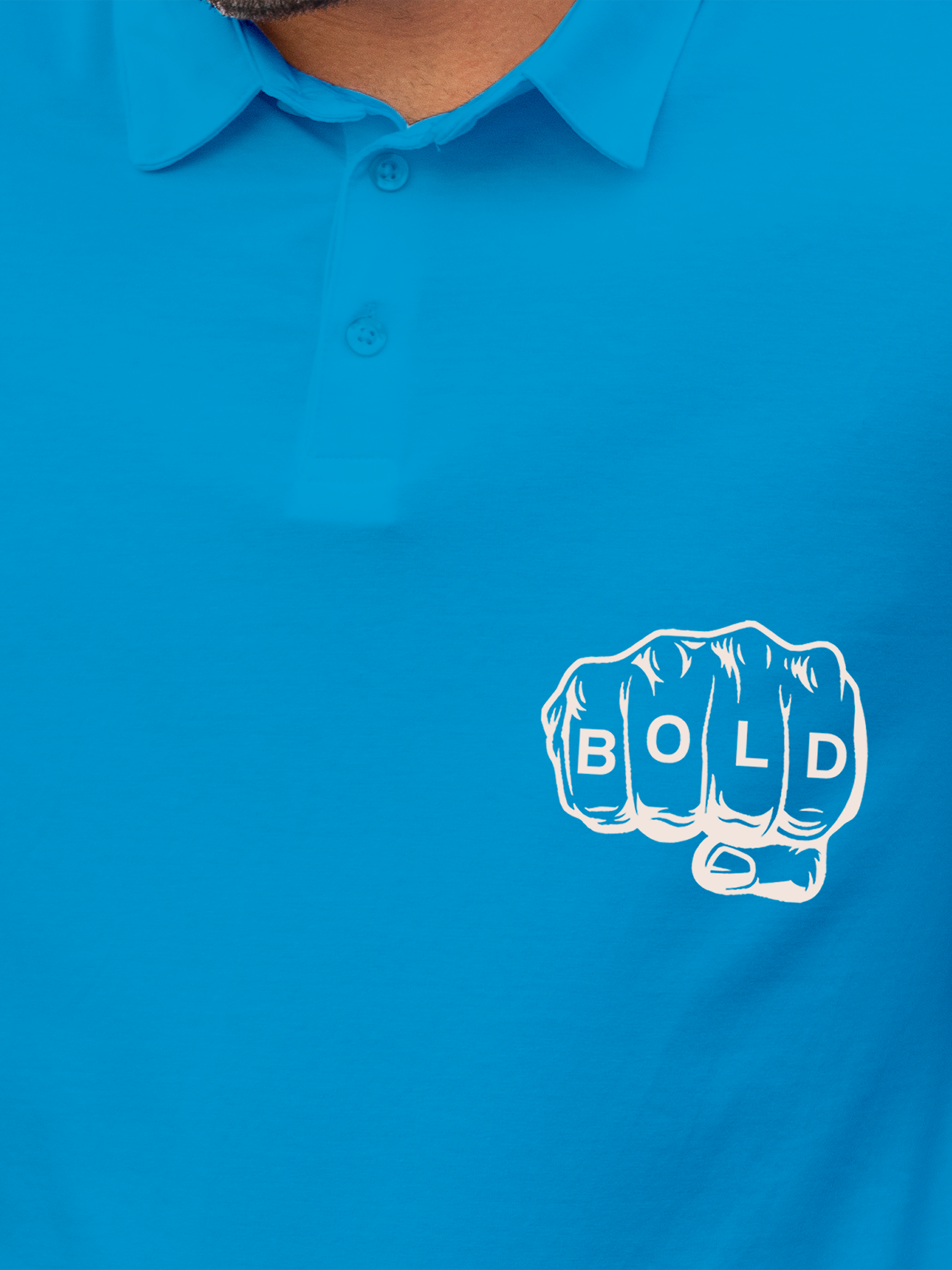 Close up of 'Bold' design on Men's Blue Polo T-shirt, highlighting intricate details and vibrant print.