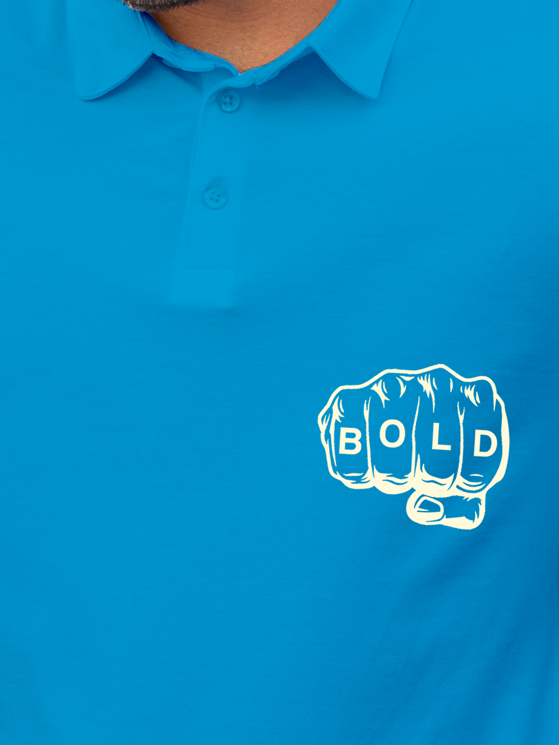 Close up of 'Bold' design on Men's Blue Polo T-shirt, highlighting intricate details and vibrant print.