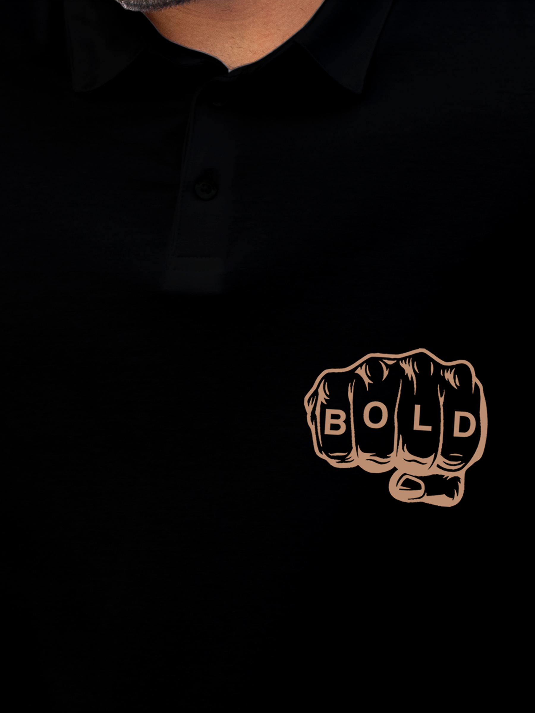 Close up of 'Bold' design on Men's Black Polo T-shirt, highlighting intricate details and vibrant print.